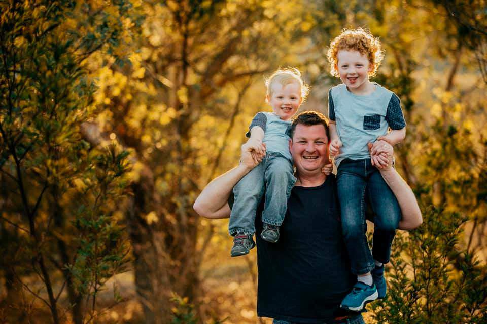 photos of dad carrying kids on shoulders