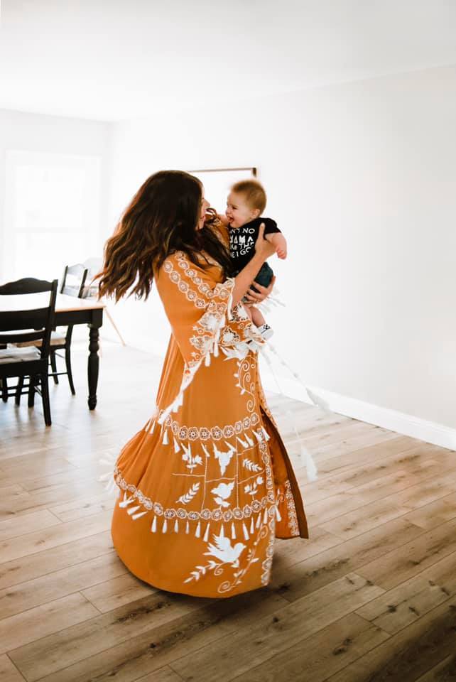 mom and baby dancing in a house