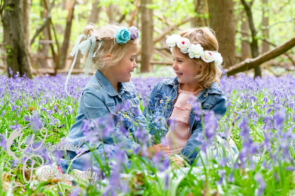 2 girls in a field of flowers with flower crowns