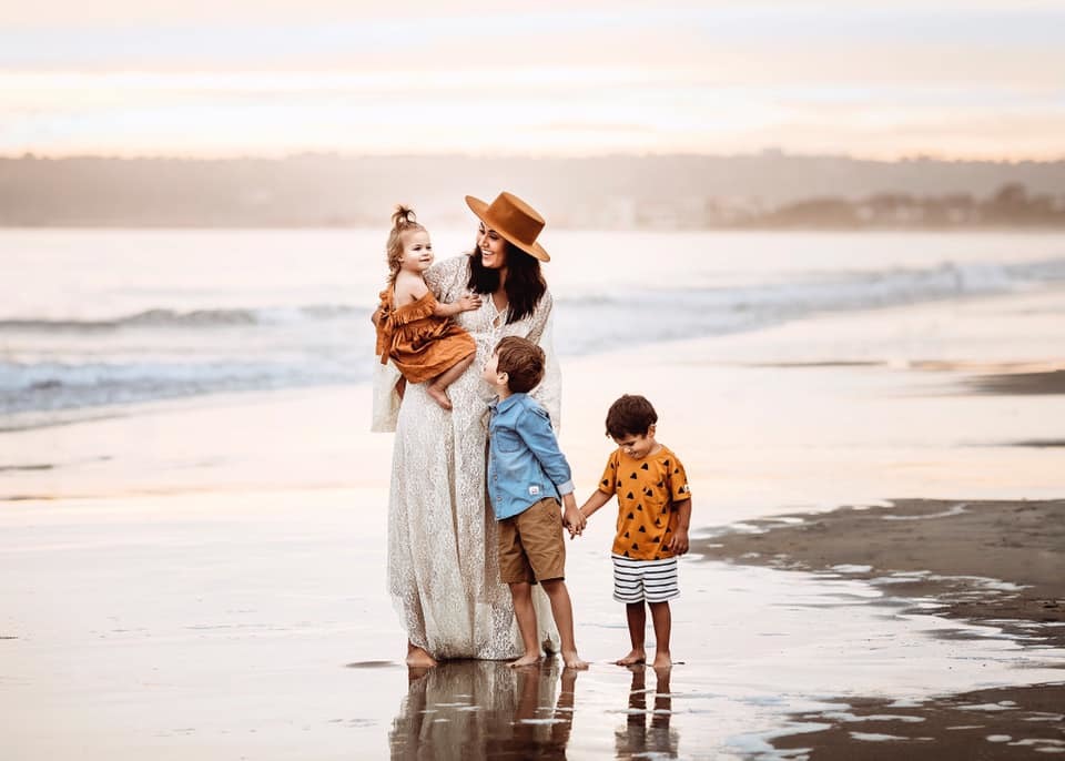 mom with three kids on beach