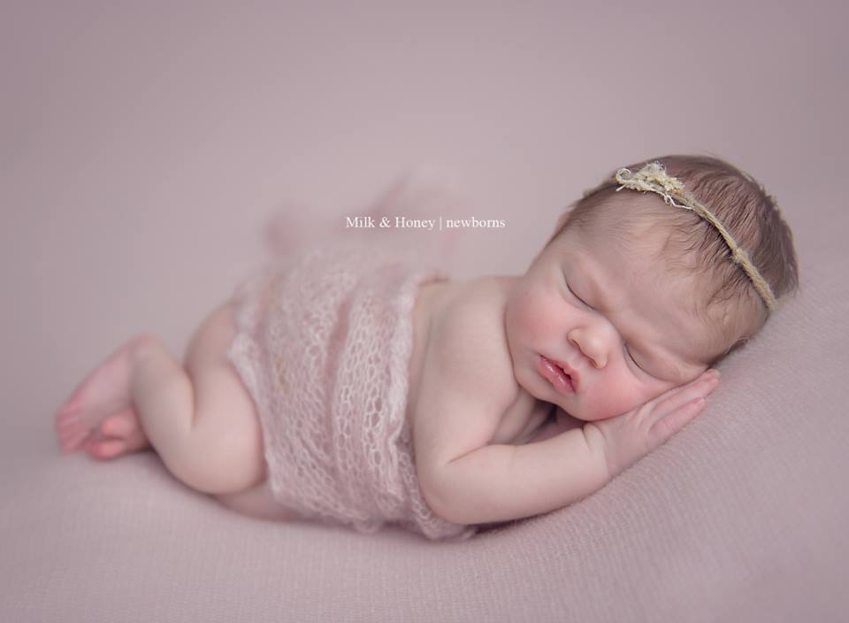 newborn with blurred background