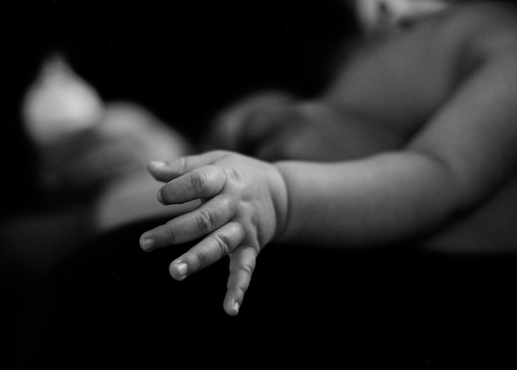 newborn hand with dimples