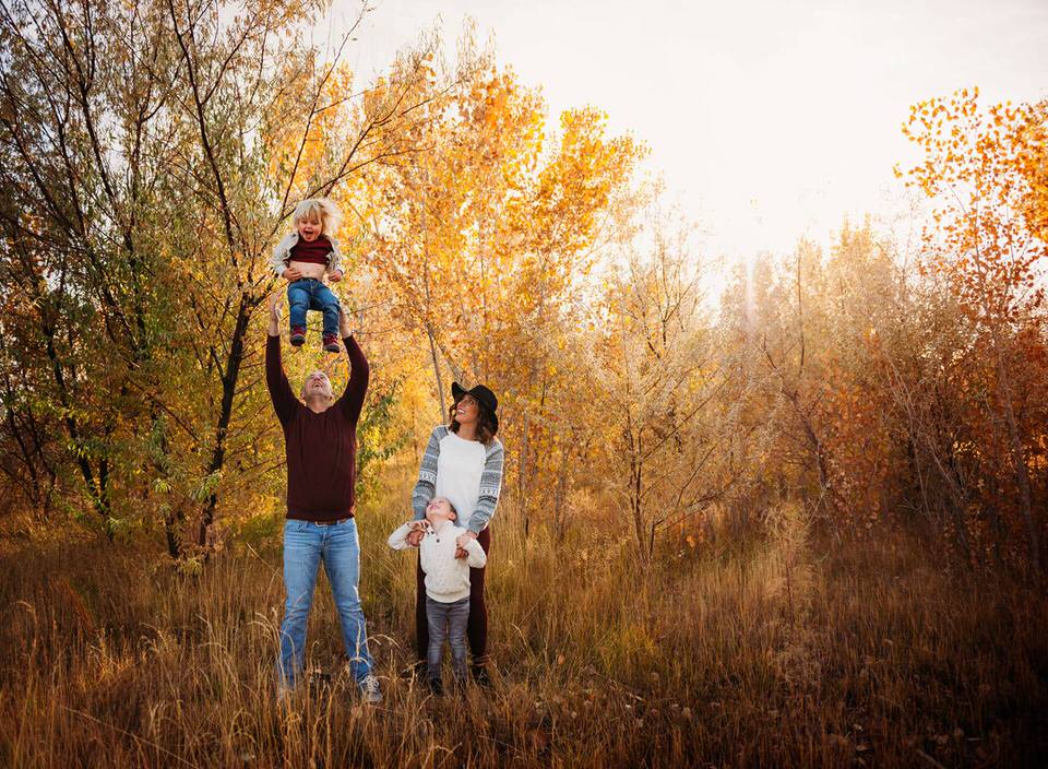 child tossed during fall family session