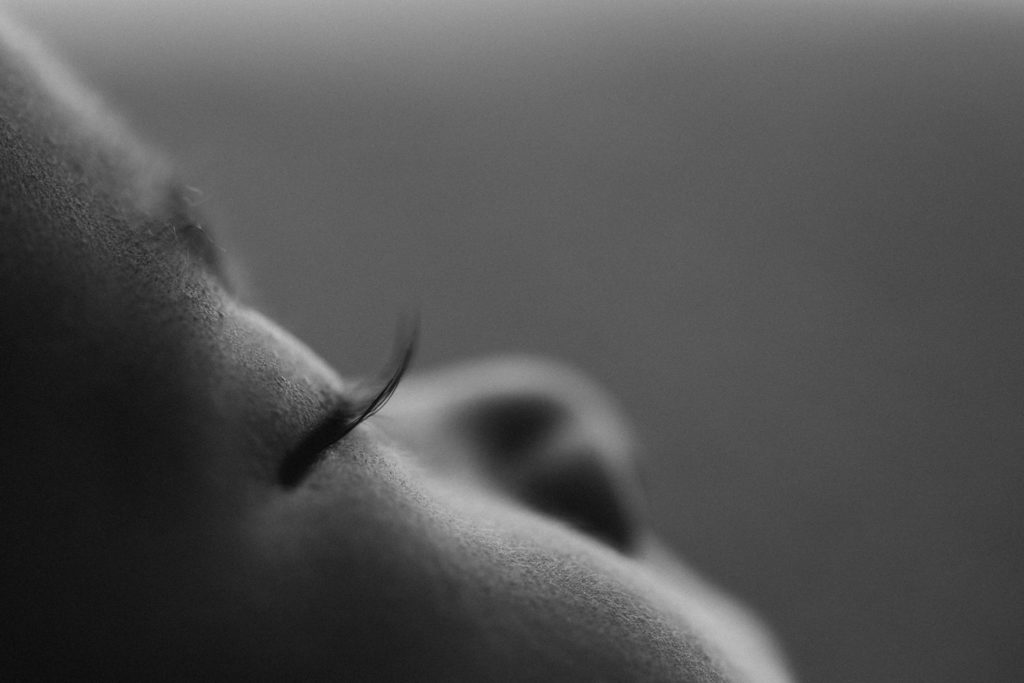 black and white profile of newborn lashes