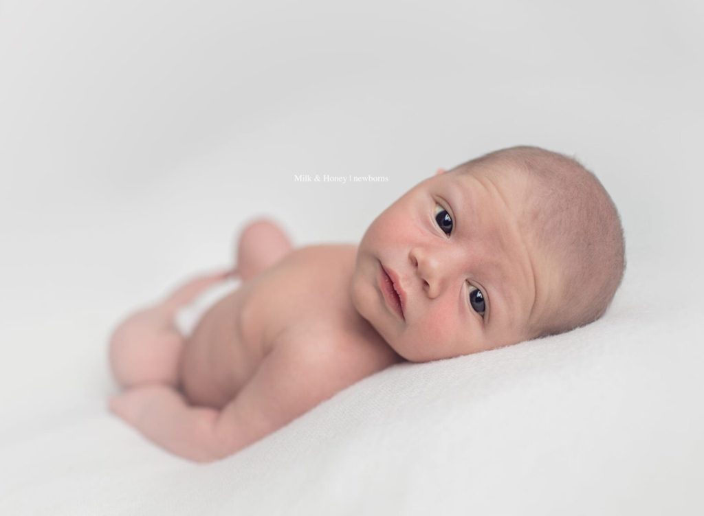 newborn photo session with awake baby