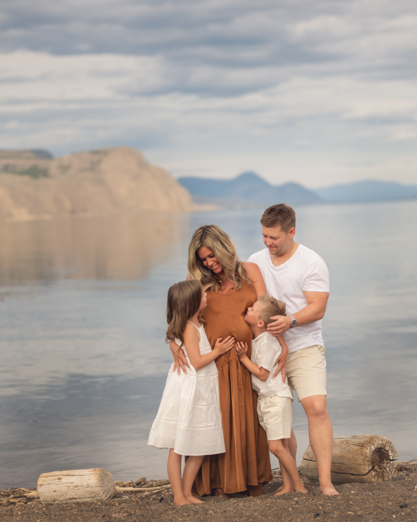 Family positioned far from mountain line showing how distance between subject and background creates separation in outdoor photos.
